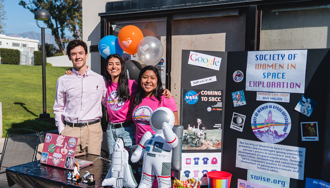 SBCC students from a club together on campus.